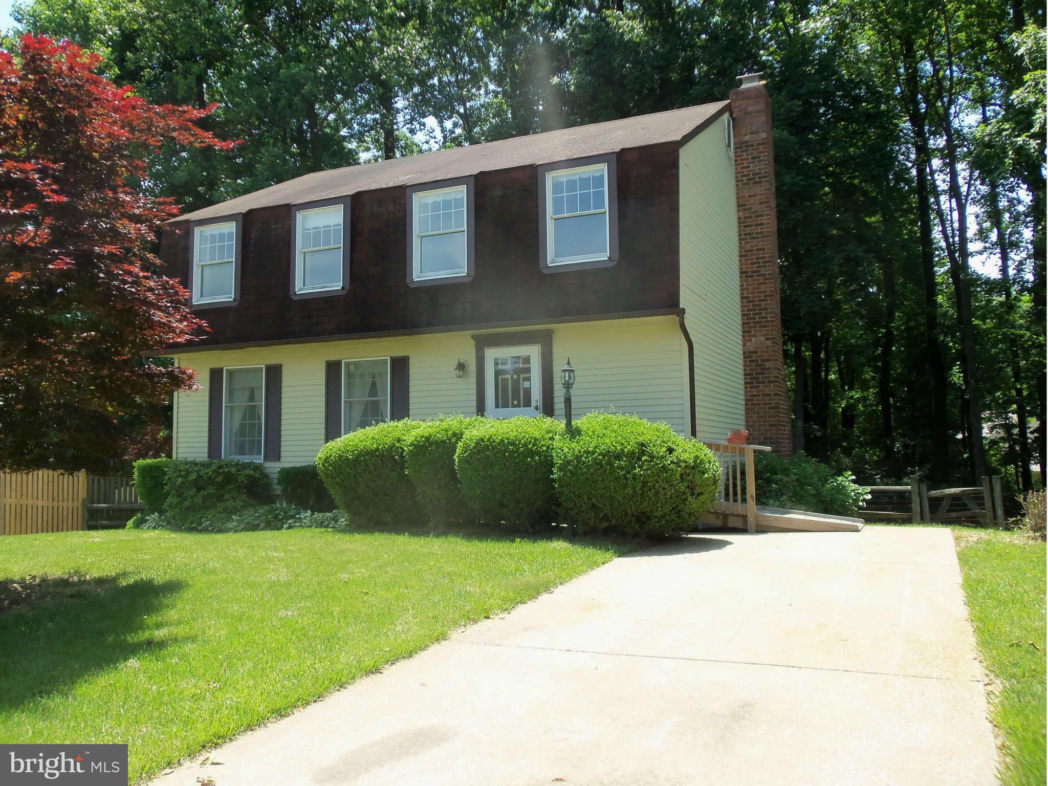 a view of a brick house with a yard