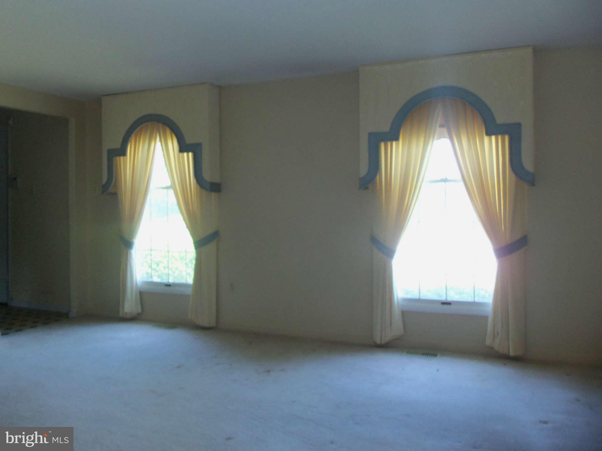 9619 Winands Road Randallstown, MD 21133 - Photo 2 of 20 an empty room with a window