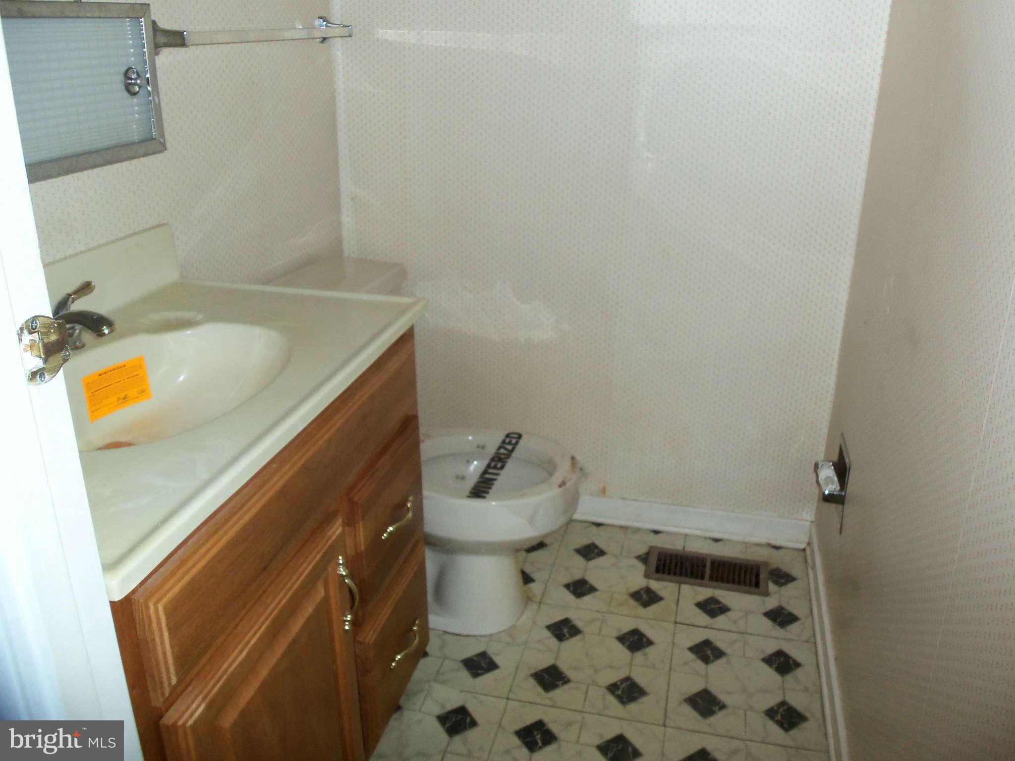 9619 Winands Road Randallstown, MD 21133 - Photo 15 of 20 a bathroom with a sink toilet and shower