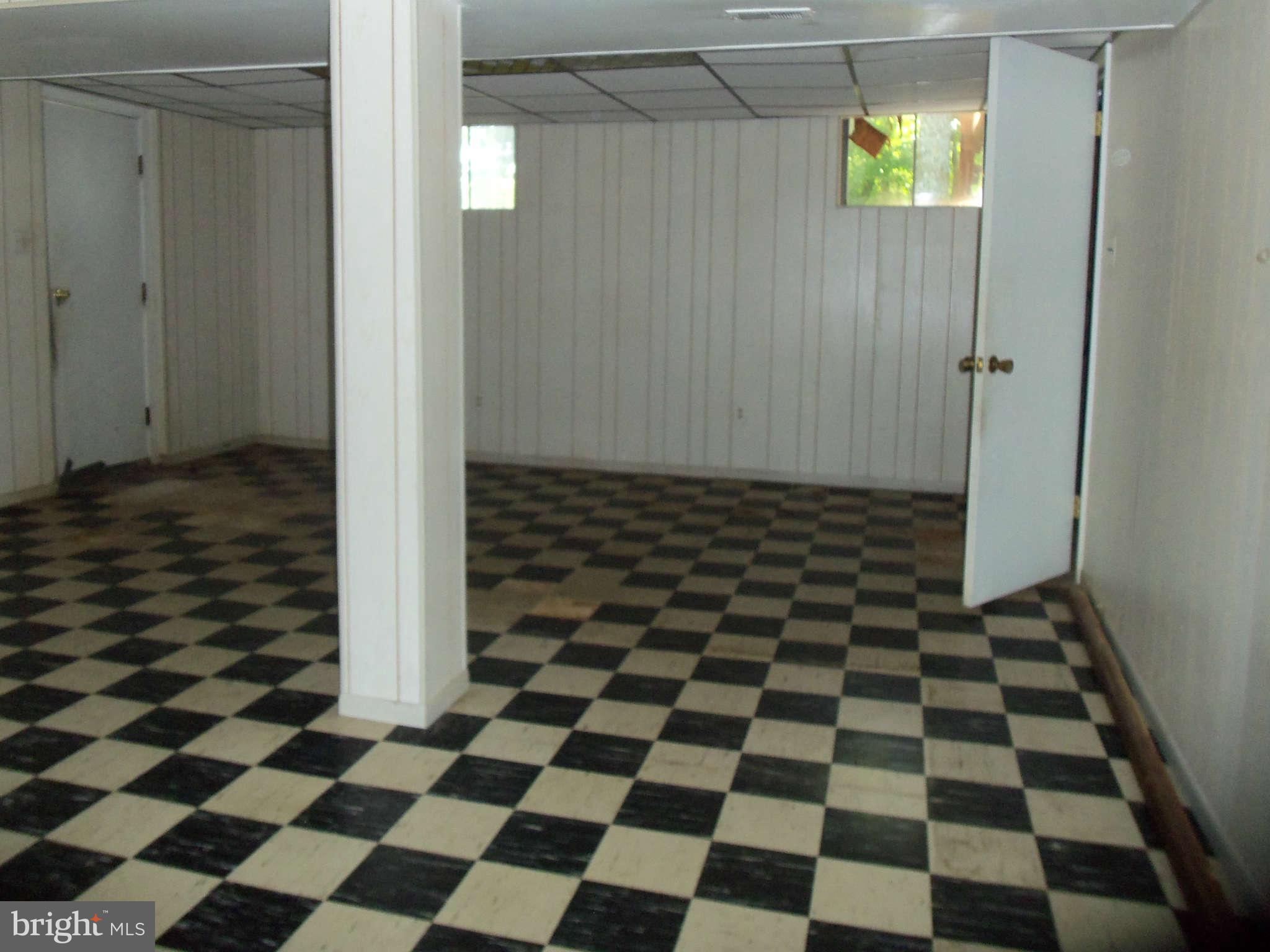 9619 Winands Road Randallstown, MD 21133 - Photo 17 of 20 a black and white checkered floor with a black white checkered floor