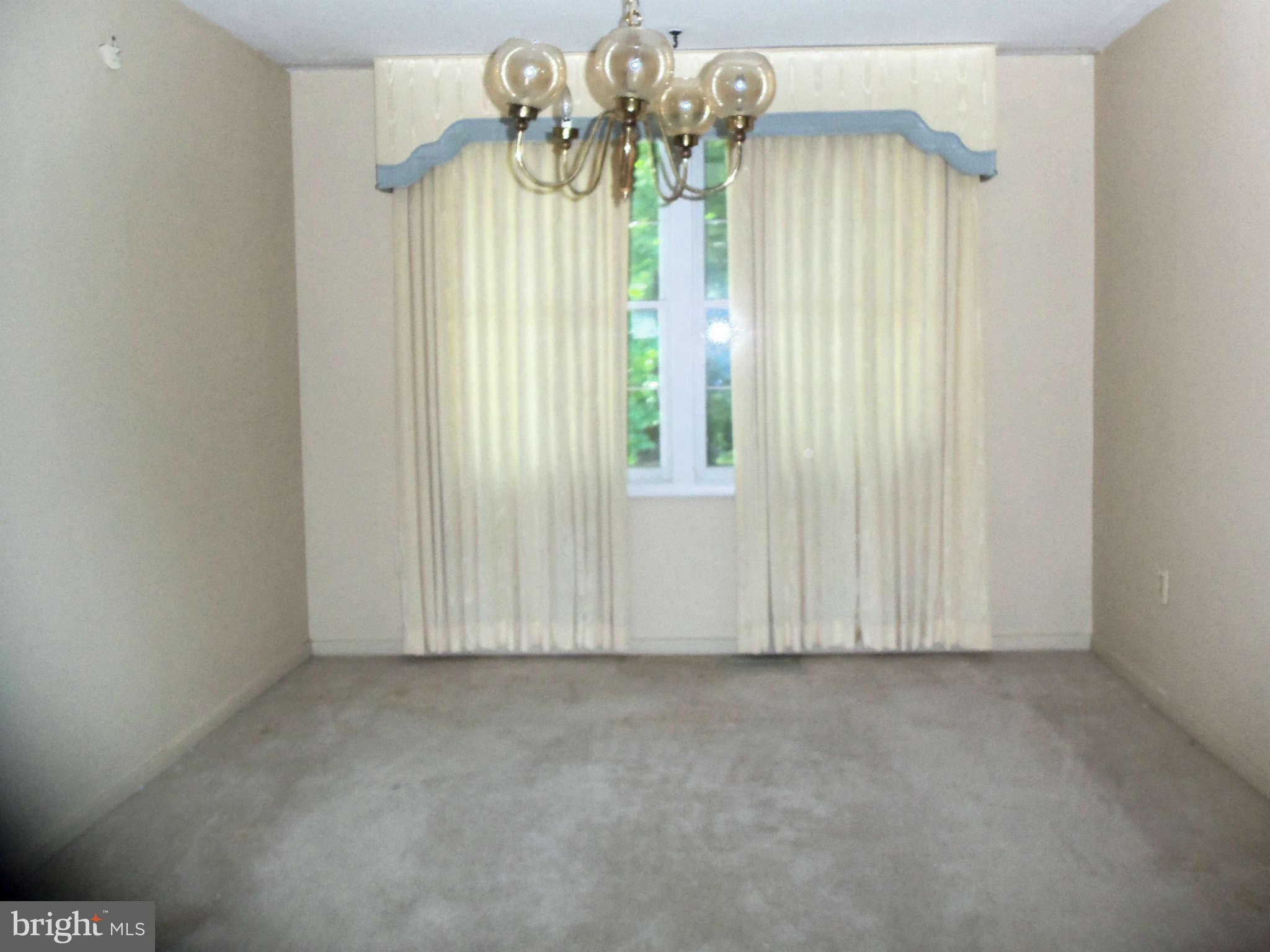 9619 Winands Road Randallstown, MD 21133 - Photo 3 of 20 a view of an empty room with a window