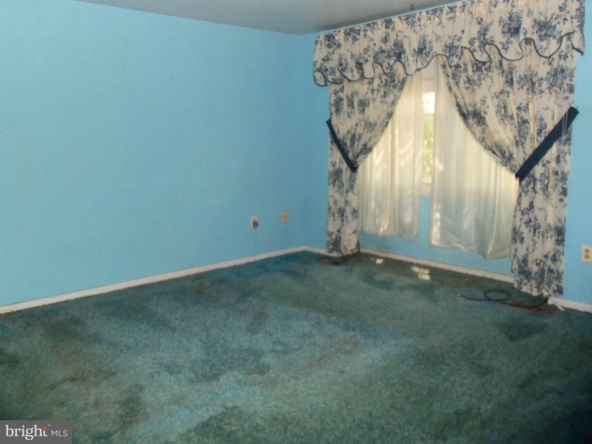 9619 Winands Road Randallstown, MD 21133 - Photo 10 of 20 an empty room with a fireplace