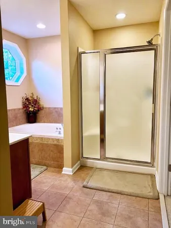 a view of a bathroom with a shower and a sink