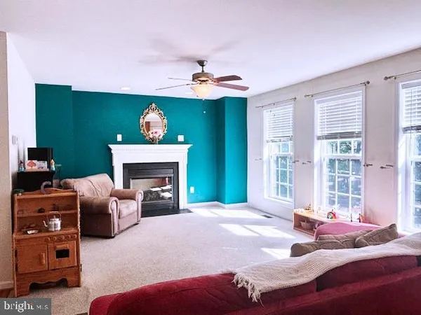 a bedroom with a bed and a fireplace