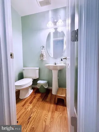 a bedroom with a bed and a mirror