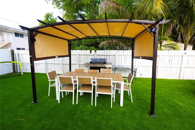 a view of an chairs and backyard