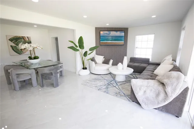 a living room with furniture and window