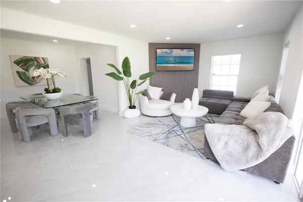 a living room with furniture and window