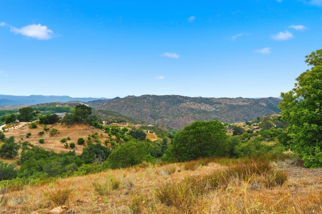 803 Quail Hill Road Fallbrook, CA 92028 - Photo 5 of 36 a view of a lake with mountains in the background