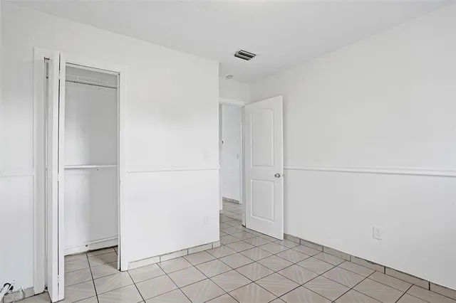 a bathroom with a sink mirror vanity and toilet