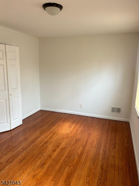 1210 Roselle Street Linden, NJ 07036 - Photo 11 of 15 a view of empty room with wooden floor