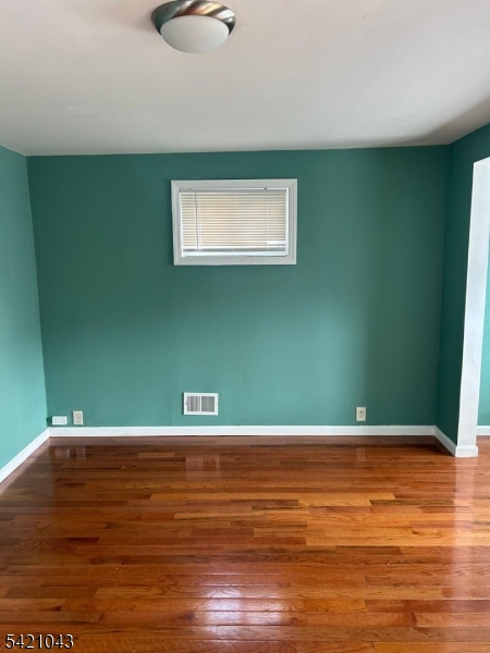 1210 Roselle Street Linden, NJ 07036 - Photo 6 of 15 a view of a room with wooden floor
