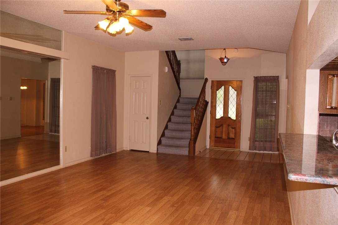 2141 Surrender Avenue Austin, TX 78728 - Photo 13 of 38 wooden floor in an empty room with a window