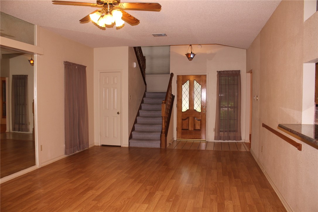 2141 Surrender Avenue Austin, TX 78728 - Photo 14 of 38 wooden floor in an empty room with a window