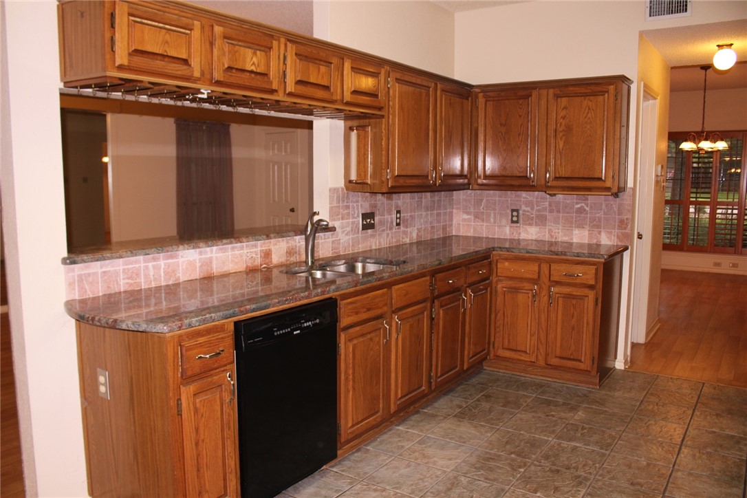 2141 Surrender Avenue Austin, TX 78728 - Photo 15 of 38 a kitchen with a sink and cabinets