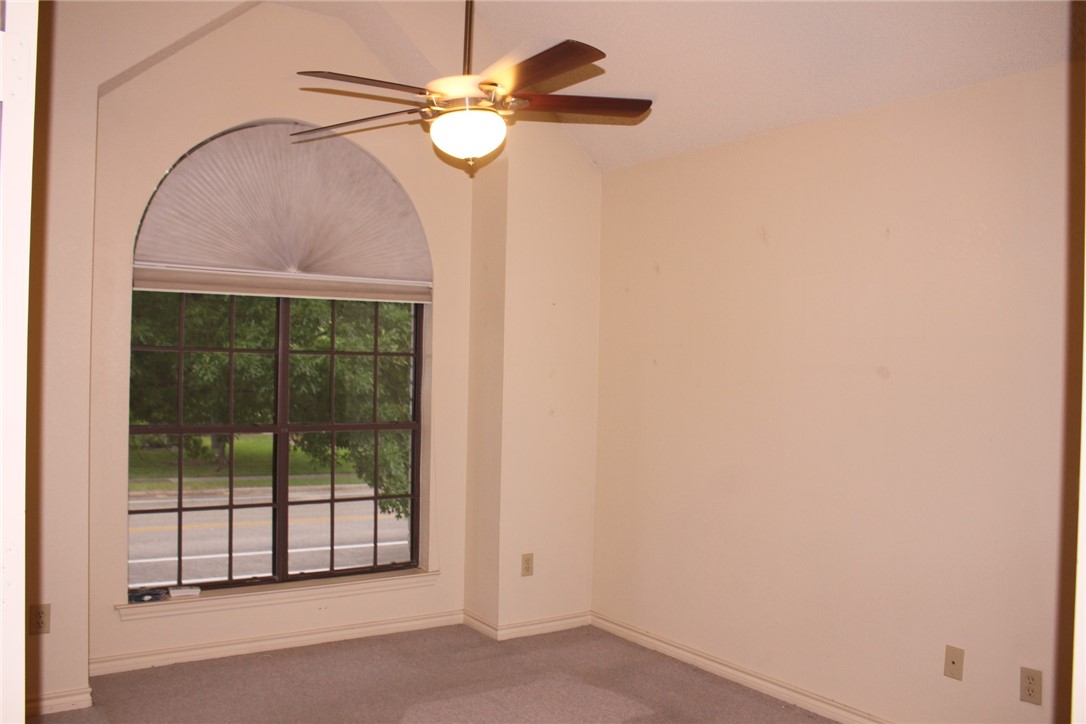 2141 Surrender Avenue Austin, TX 78728 - Photo 18 of 38 a view of a livingroom with a ceiling fan and window