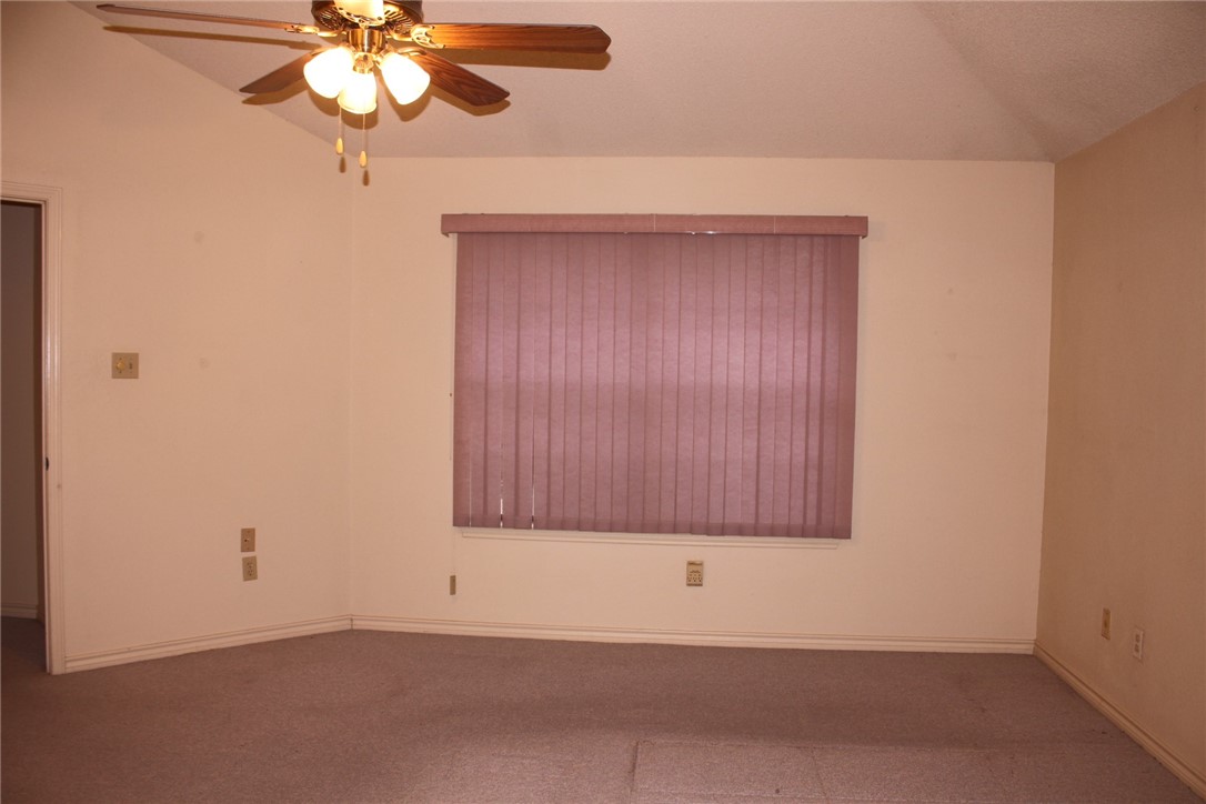 2141 Surrender Avenue Austin, TX 78728 - Photo 31 of 38 an empty room with a chandelier fan