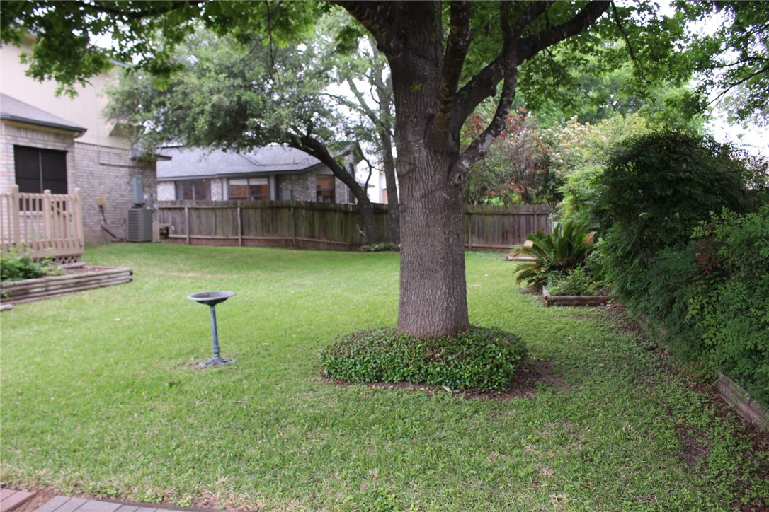 2141 Surrender Avenue Austin, TX 78728 - Photo 35 of 38 a view of backyard with a garden and trees