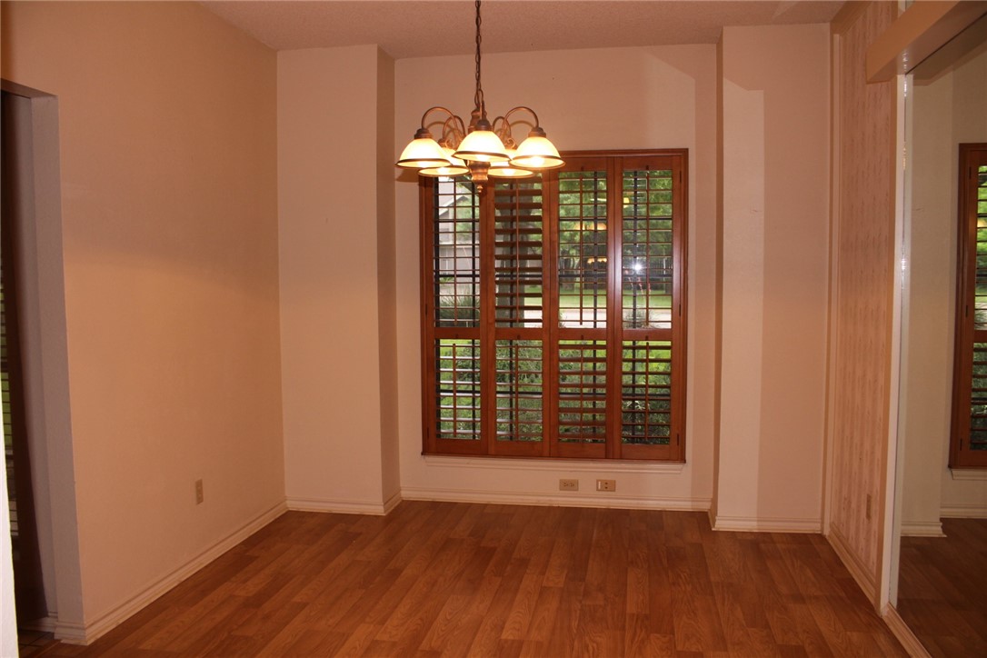 2141 Surrender Avenue Austin, TX 78728 - Photo 7 of 38 a view of a room with wooden floor and large window