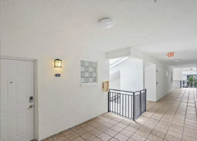 a view of a hallway with windows