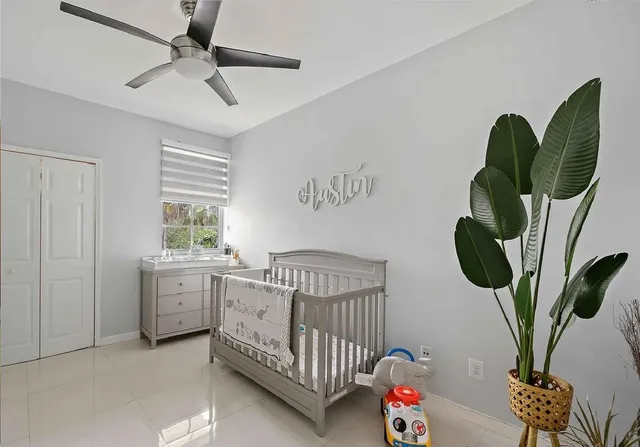 a bedroom with furniture and a window