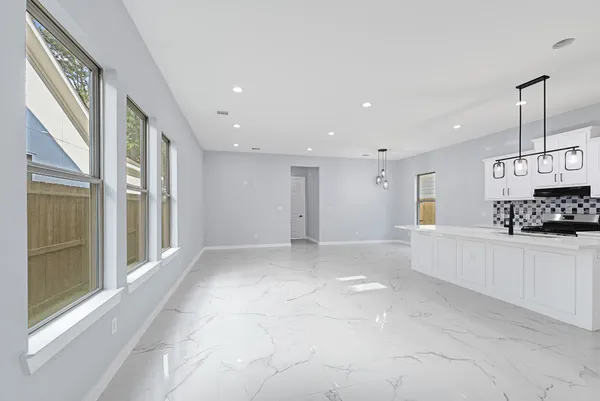 a view of a kitchen with a sink and cabinets