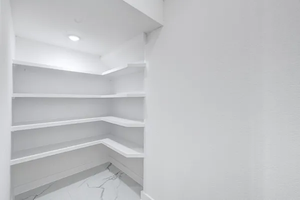 a view of an empty walk in closet