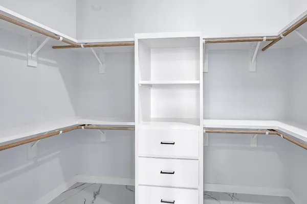 a view of an empty walk in closet