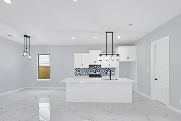 a view of living room with furniture and chandelier