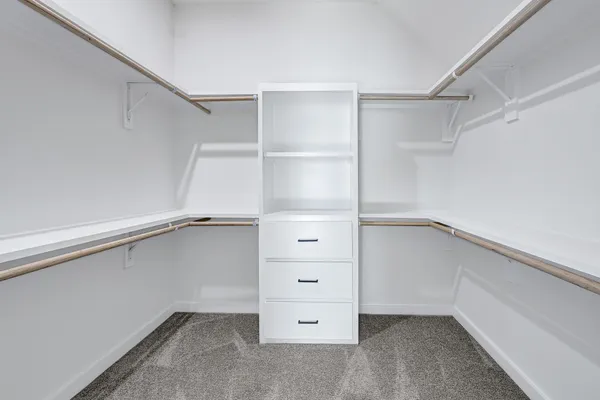 a view of an empty walk in closet