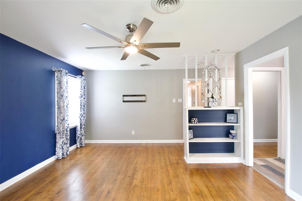 1307 North 65th Street Waco, TX 76710 - Photo 7 of 35 a view of empty room with wooden floor and fan