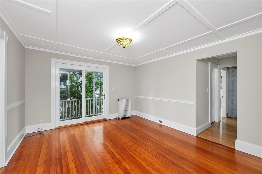 18 Bennett Street, Unit 2 Manchester, MA 01944 - Photo 6 of 21 wooden floor in an empty room with a window