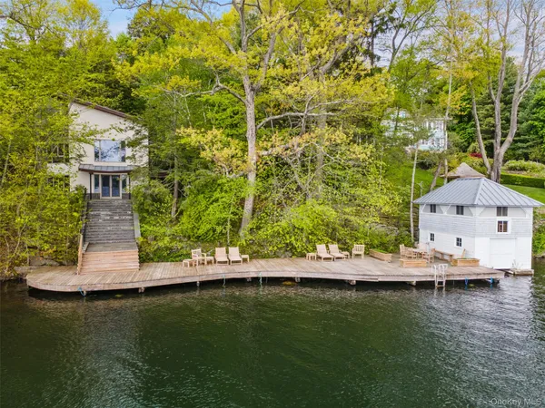 a view of a wooden deck with a yard