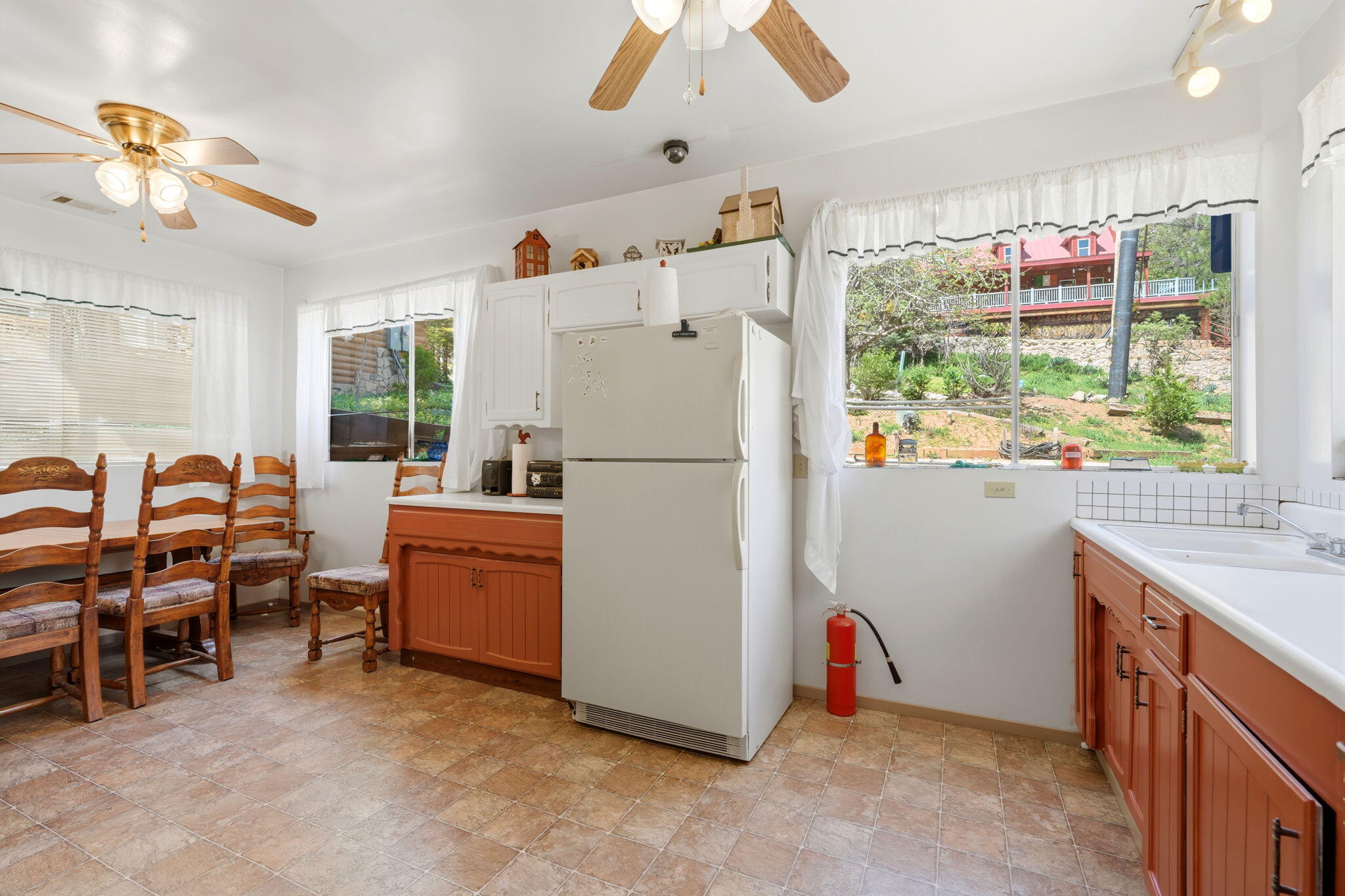 697 Loop Drive Springville, CA 93265 - Photo 22 of 55 a kitchen with refrigerator and window