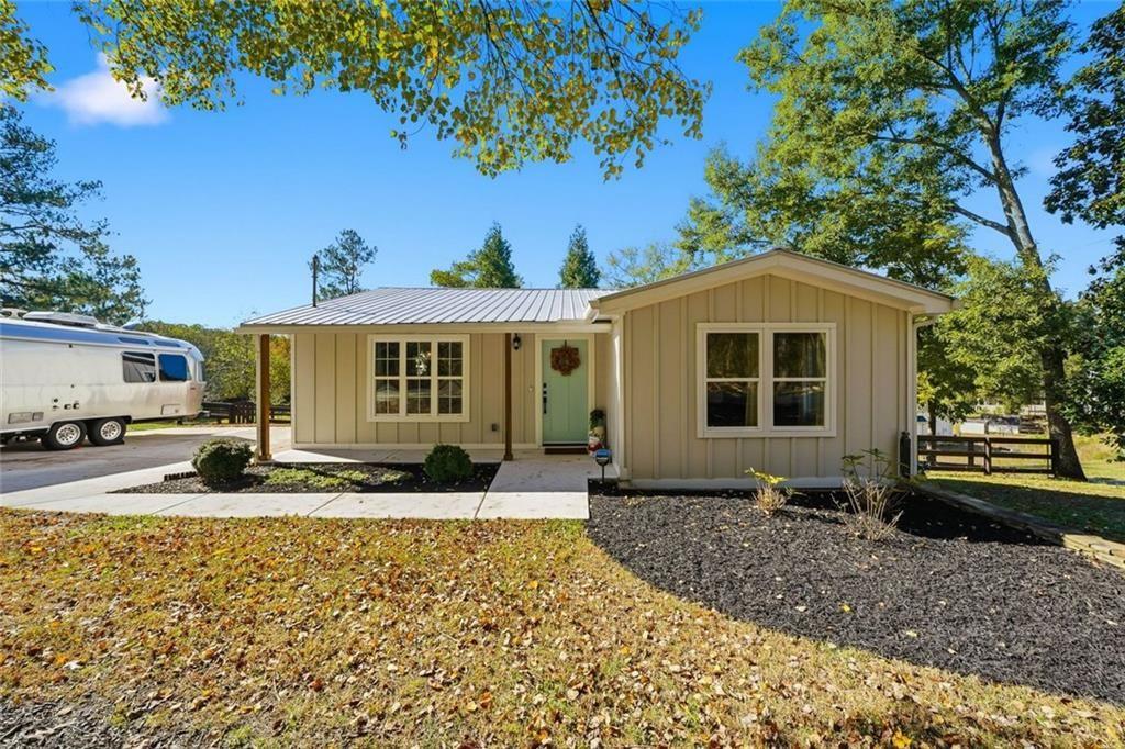 a front view of a house with garden