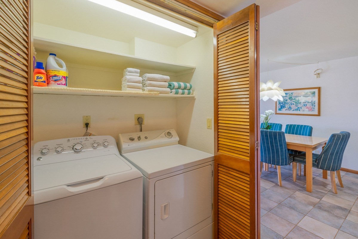 1661 Pee Road, Unit IIA101 Koloa, HI 96756 - Photo 20 of 28 a utility room with dryer and washer