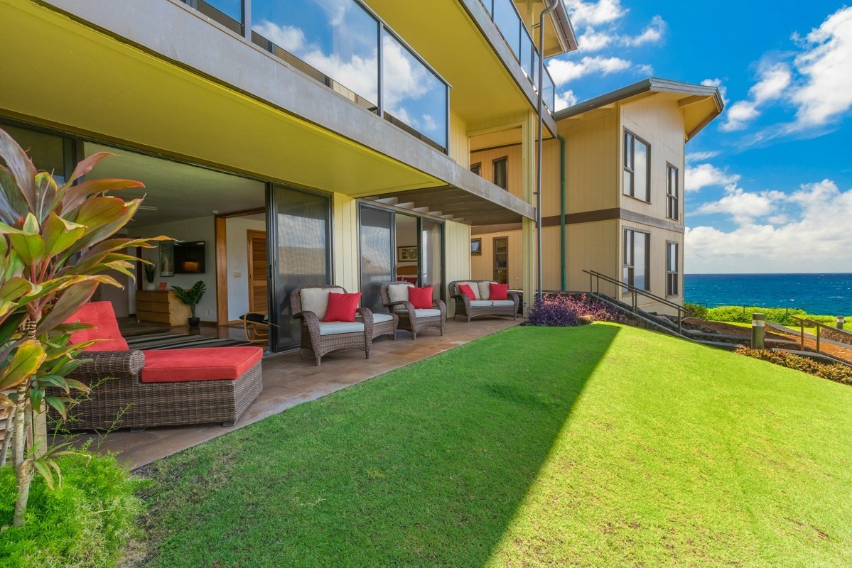 1661 Pee Road, Unit IIA101 Koloa, HI 96756 - Photo 2 of 28 a view of yard of the house with outdoor seating
