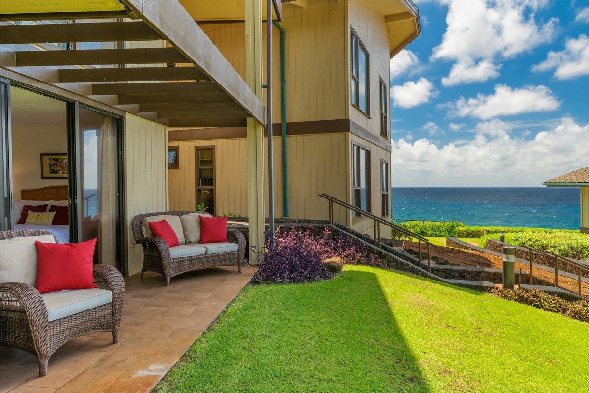 1661 Pee Road, Unit IIA101 Koloa, HI 96756 - Photo 21 of 28 a backyard of a house with seating space
