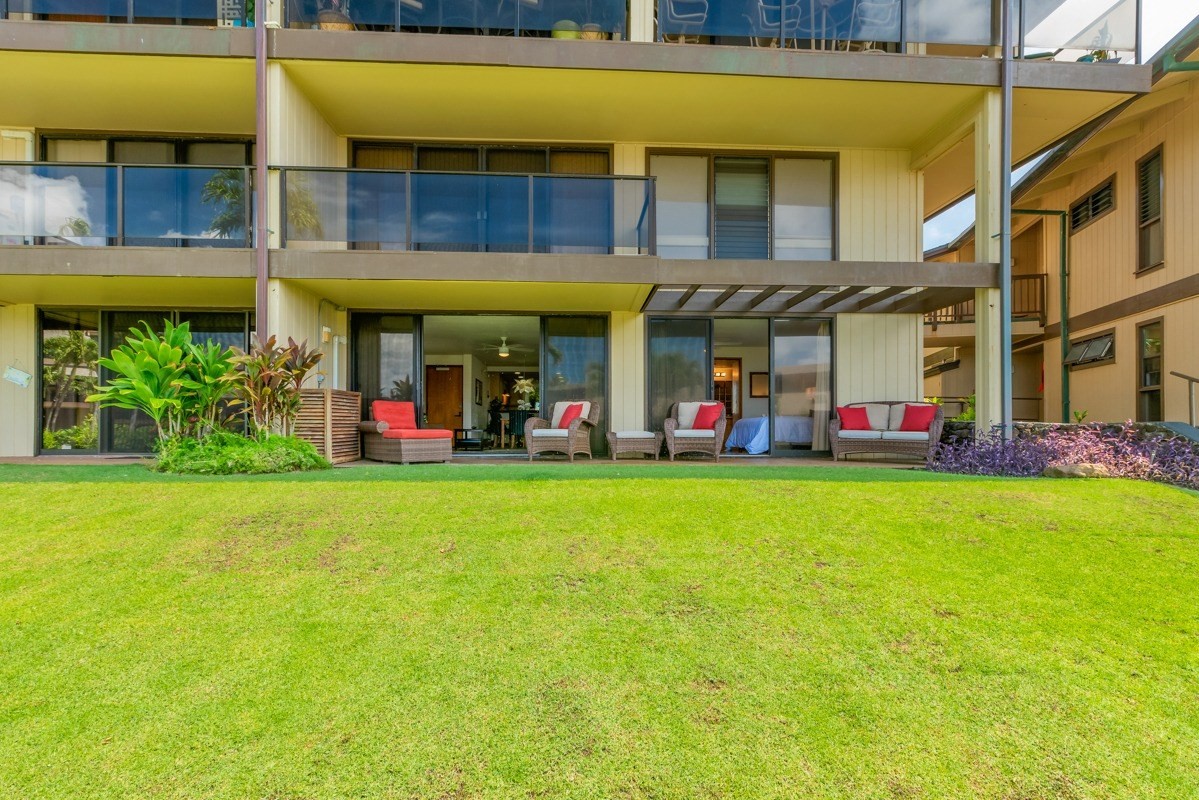 1661 Pee Road, Unit IIA101 Koloa, HI 96756 - Photo 25 of 28 a view of group of people with umbrellas