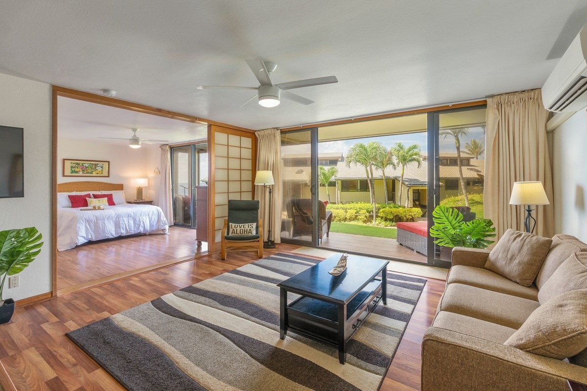 1661 Pee Road, Unit IIA101 Koloa, HI 96756 - Photo 4 of 28 a living room with furniture and a large window