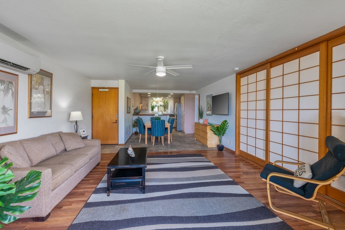 1661 Pee Road, Unit IIA101 Koloa, HI 96756 - Photo 7 of 28 a living room with furniture and a table