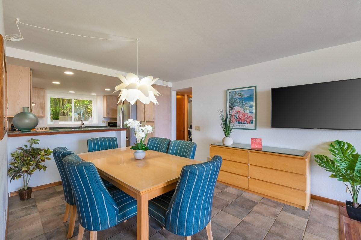1661 Pee Road, Unit IIA101 Koloa, HI 96756 - Photo 9 of 28 a dining room with furniture and window