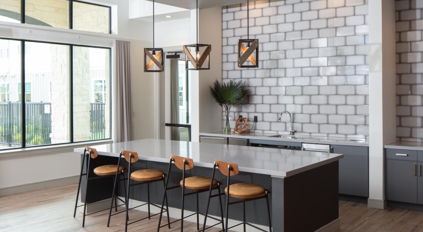12111 South Main Street, Unit 7302 Houston, TX 77035 - Photo 24 of 24 a kitchen with a sink and chairs