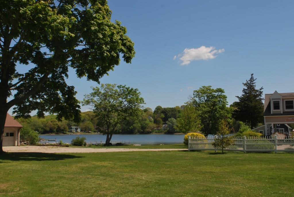 3 A Cove Road Stonington, CT 06378 - Photo 1 of 1 a view of a swimming pool with a yard