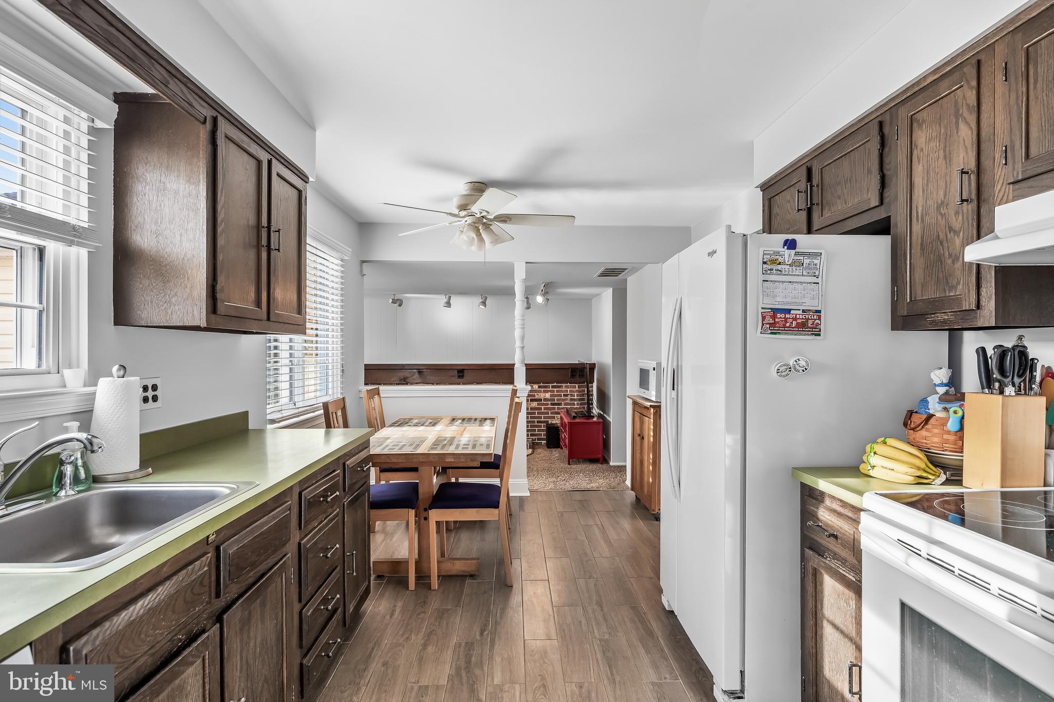 207 Farmington Road Delran, NJ 08075 - Photo 12 of 30 a kitchen that has a lot of cabinets a sink and wooden floor