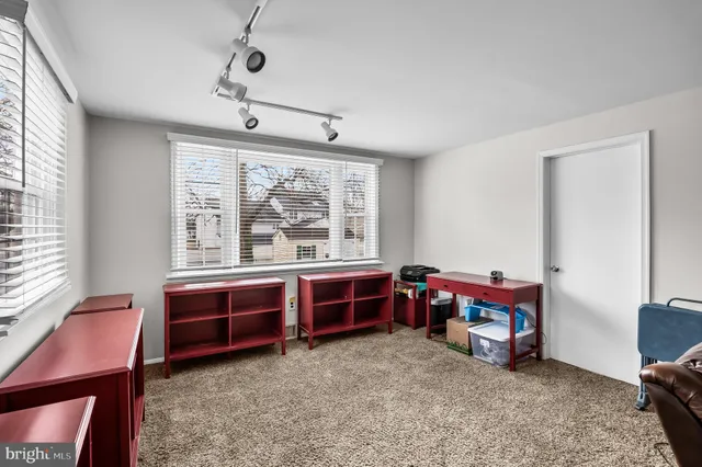 a view of a room with furniture window and a ceiling fan