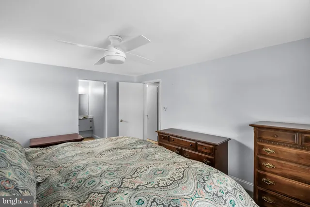 a bedroom with a bed and a dresser