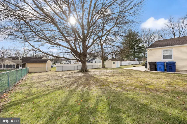 a large tree in front of a house