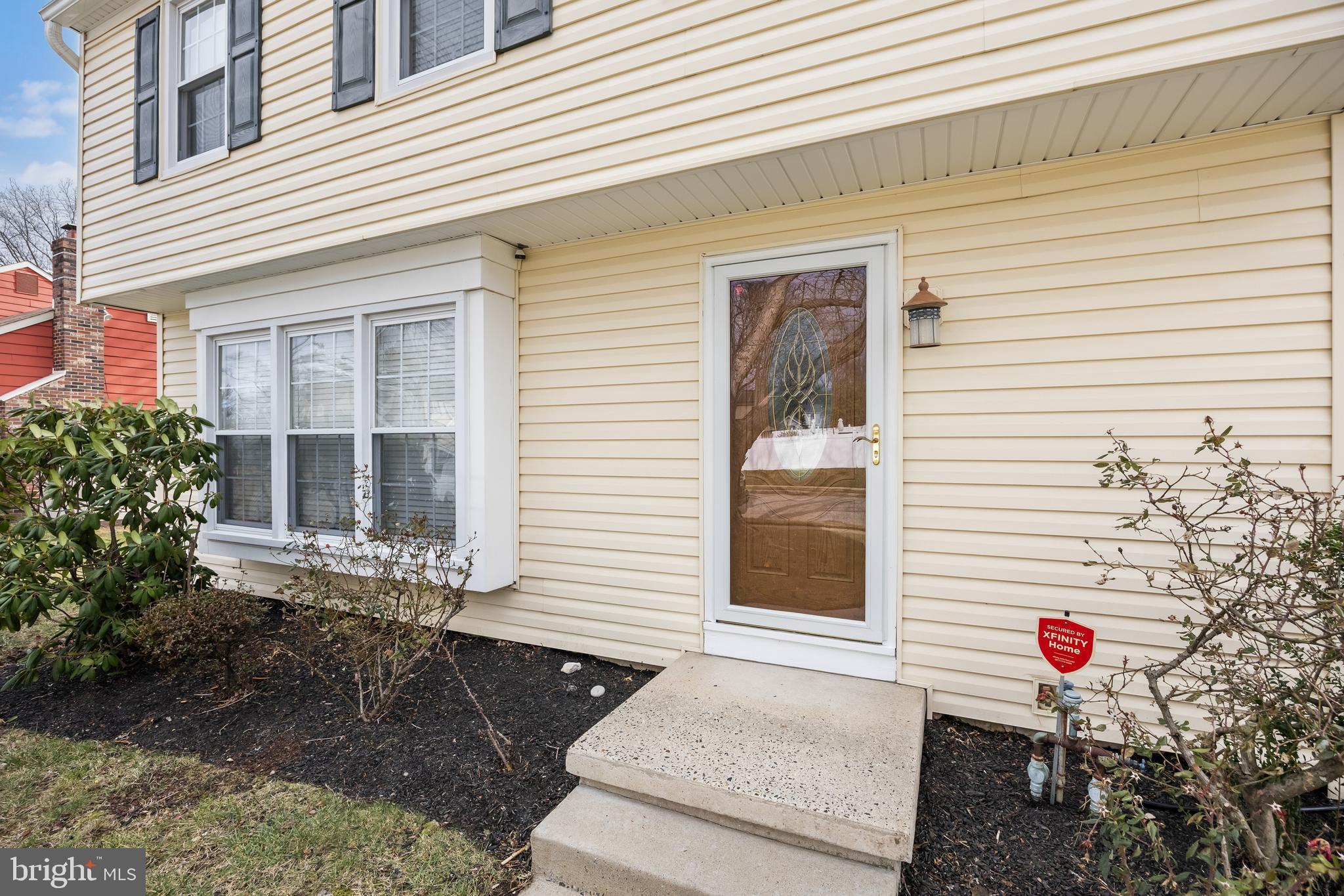 207 Farmington Road Delran, NJ 08075 - Photo 4 of 30 a front view of a house with a yard