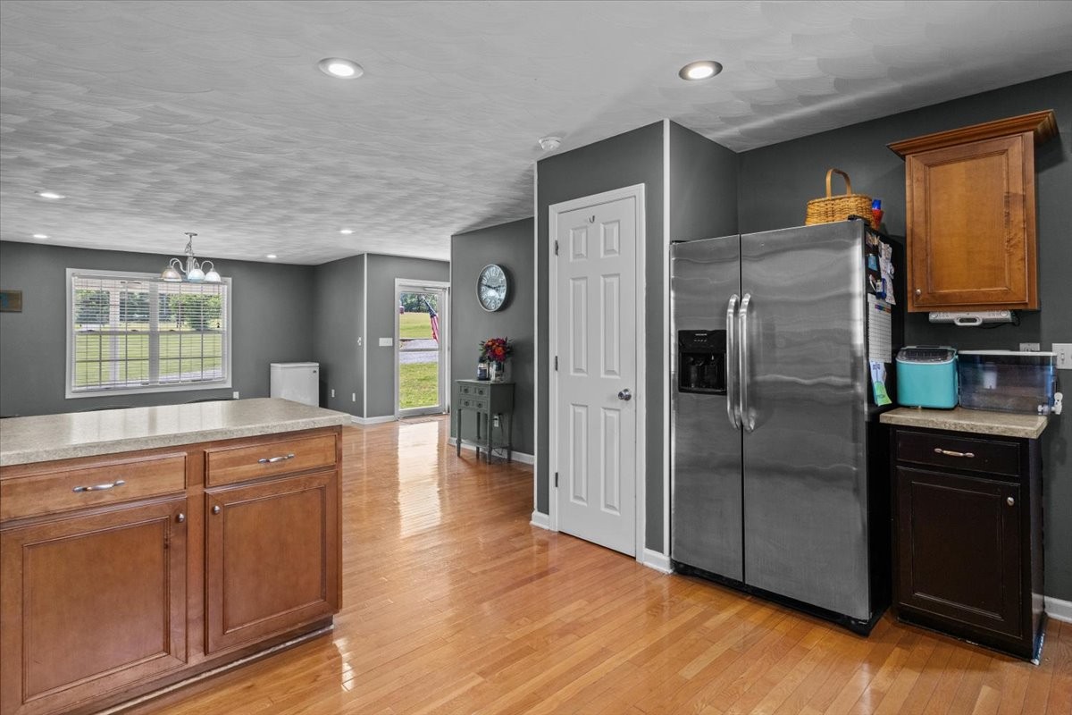 109 Bessie Clark Road Erin, TN 37061 - Photo 12 of 43 a kitchen with stainless steel appliances a refrigerator and a stove